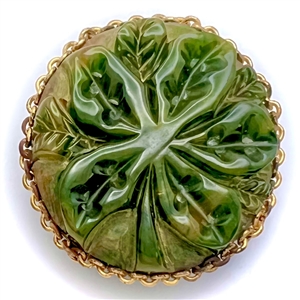 Carved jade button of leaves.