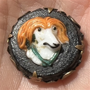 Adorable painted glass dog head over leather set in brass button. 