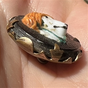 Adorable painted glass dog head over leather set in brass button. 