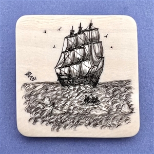 Modern scrimshaw of sailing ship and whalers going after a whale.