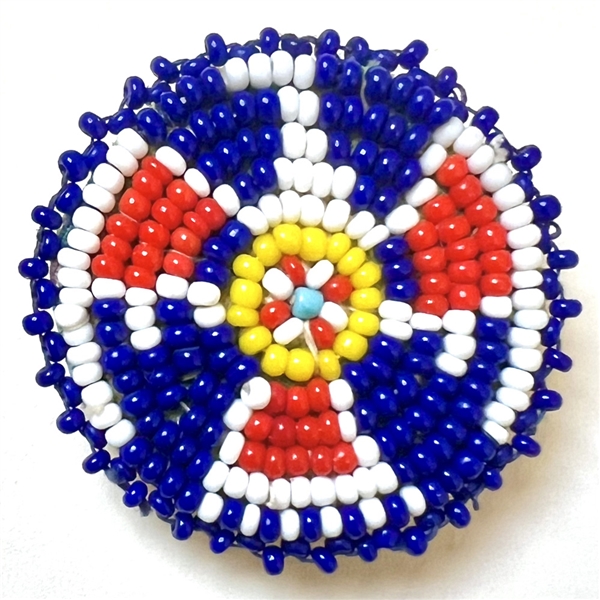 Native American beaded button of a thunderbird symbol.