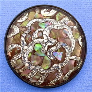 Extra large design under glass button of abalone chips and white metal.