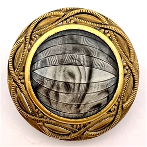 Imitation fabric reverse painted under glass set in brass button.