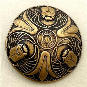 Brass button with three Egyptian scarabs.