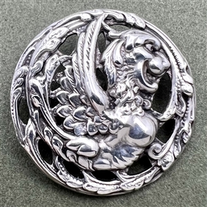 Hallmarked silver button of a fabulous creature.