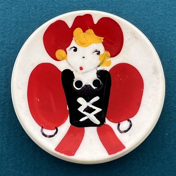 Vintage plastic button of a cool cowgirl.