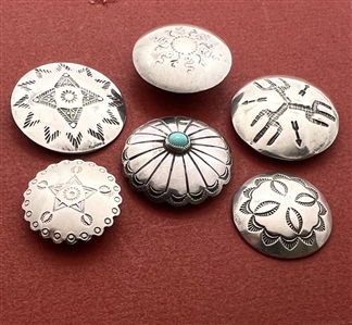 Six Native American silver buttons.