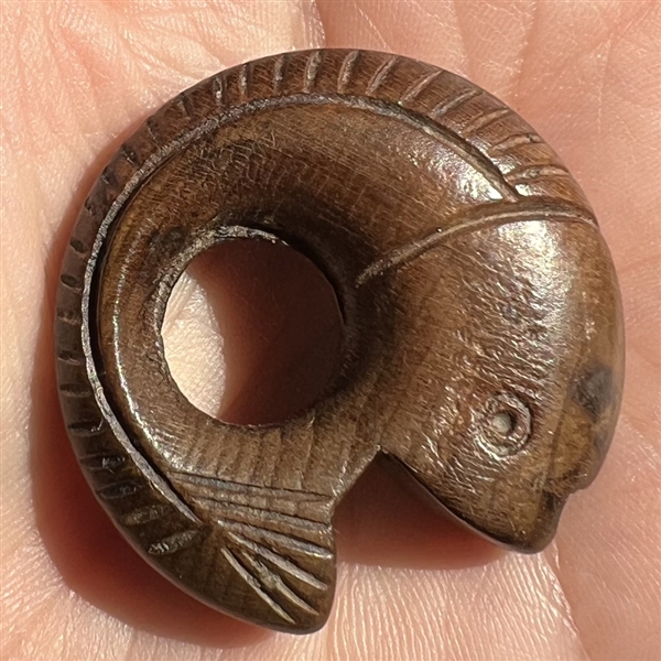 Vintage wood button of a fish.