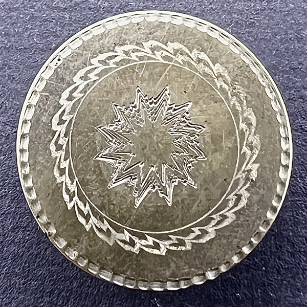 An 18th c. Tombac button of sun burst and borders.