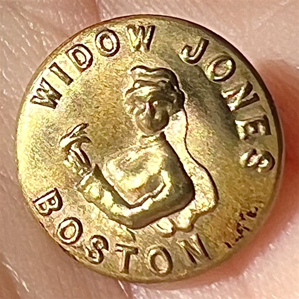 Rare “Widow Jones” brass work clothes button.