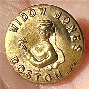 Rare “Widow Jones” brass work clothes button.