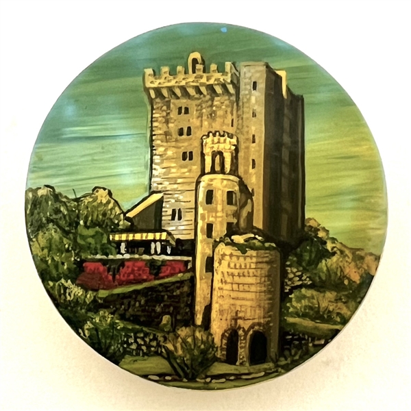 Castle painted on shell studio button signed “Shaw.”