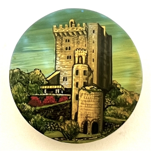 Castle painted on shell studio button signed “Shaw.”