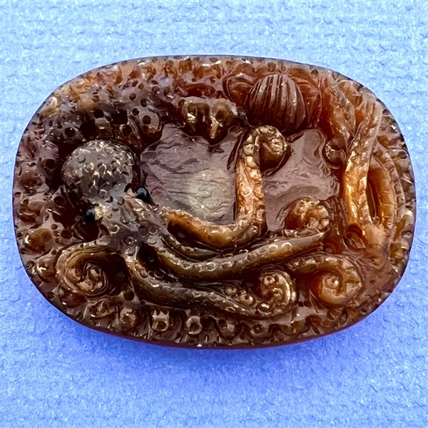 Resin or polymer button of an octopus. 