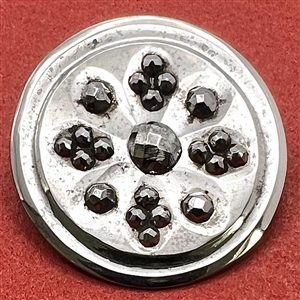 An 18th c. Steel button with concave design elements and cut steel.