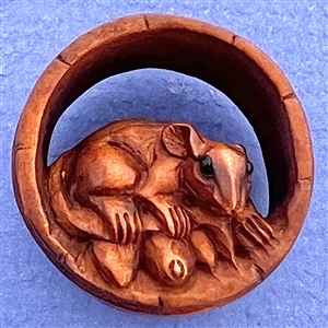 Mouse in a barrel boxwood button.