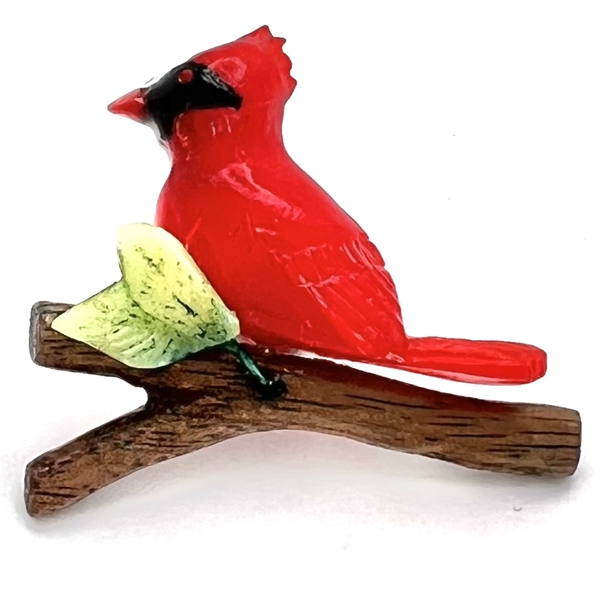 Studio Bakelite studio button of bird on branch by Bill Wegner.