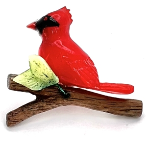 Studio Bakelite studio button of bird on branch by Bill Wegner.