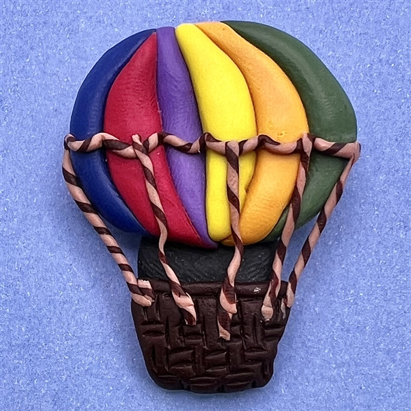 Fimo clay studio button of hot air balloon.