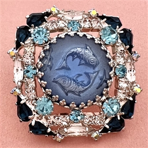 Reverse carved glass of fish (Pisces) set in white metal button with rhinestones.