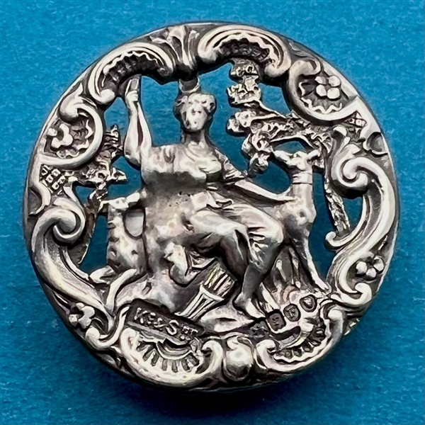 Hallmarked silver button of the goddess “Diana.”