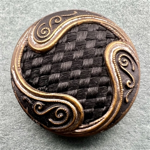 Hair button with brass decoration.