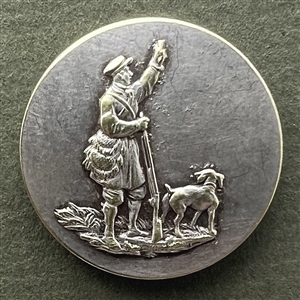 Sporting button of a hunter and his hunting dog.