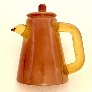 Vintage celluloid button of realistic coffee pot.