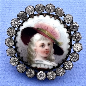 A 19th c. button of a woman huge hat with feather.