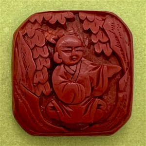 Chinese Cinnabar button of an Asian man.