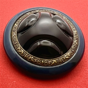 Art Deco black glass with brass and celluloid button.