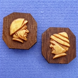 Two carved wood buttons by André Bourgault.