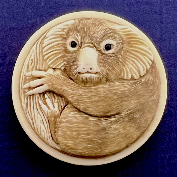 Carved natural material button of an Australian Koala bear. 