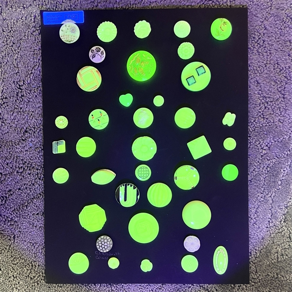 Card of 39 Uranium glass buttons.