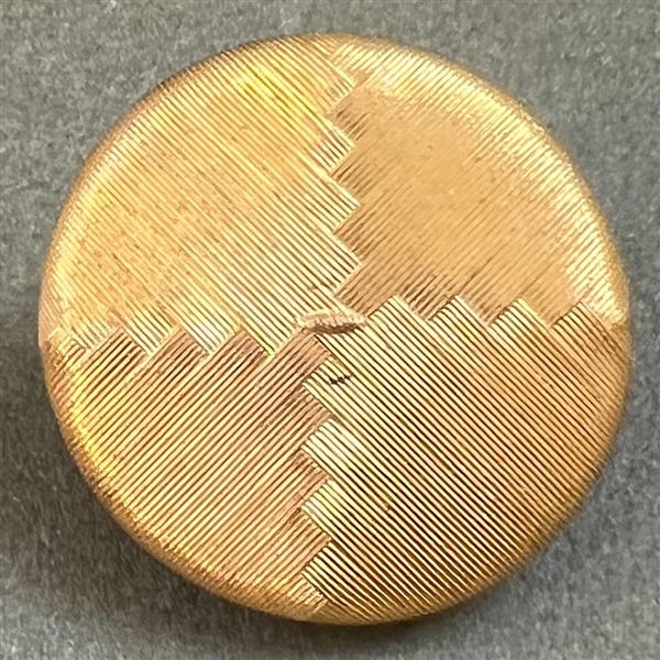 An 18th c. woven gold metal cap button of deaths head design.