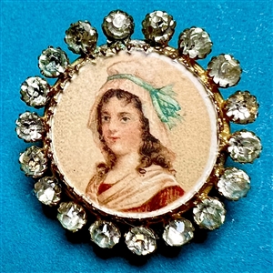 Woman in a bonnet with blue bow button.