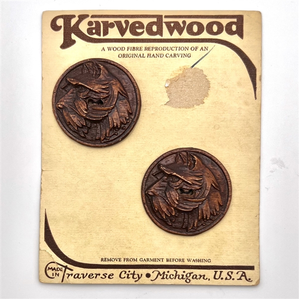 Two Burwood buttons of terrier dogs on original sales card.