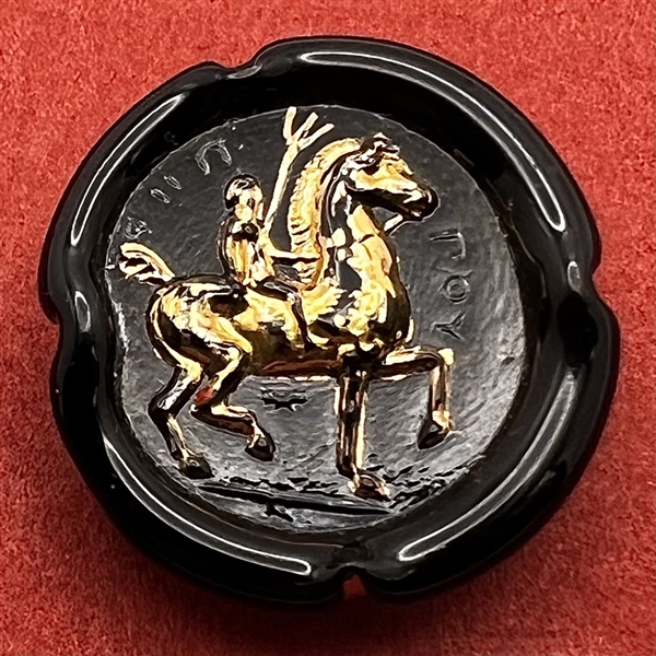 Bimini black glass button of a man on horseback. 