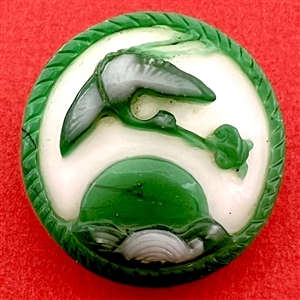 Large Chinese Peking glass button of a heron flying over water with a fish.