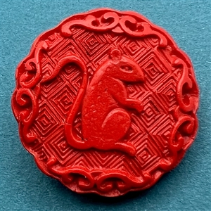 Modern “cinnabar” button of a rat.