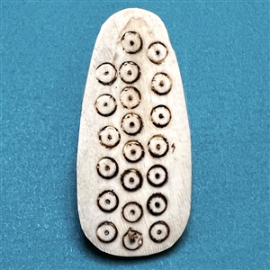 Unusual shape Inuit natural material button with pattern.