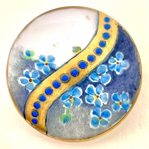 Painted porcelain button of forget-me-not flowers.