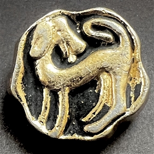 French aluminum button of a dog.