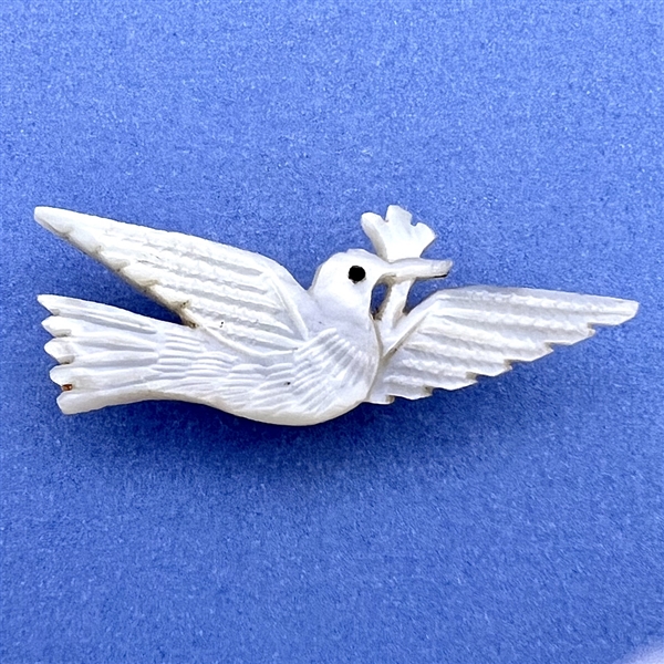 Bethlehem pearl button of realistic dove with olive branch.