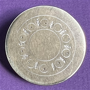 An 18th c. Tombac button with center designs.