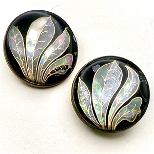 Two reverse painted glass buttons of leaves.