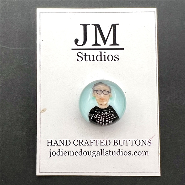 Murrine glass studio button of Ruth Bader Ginsburg by Jodie McDougall.