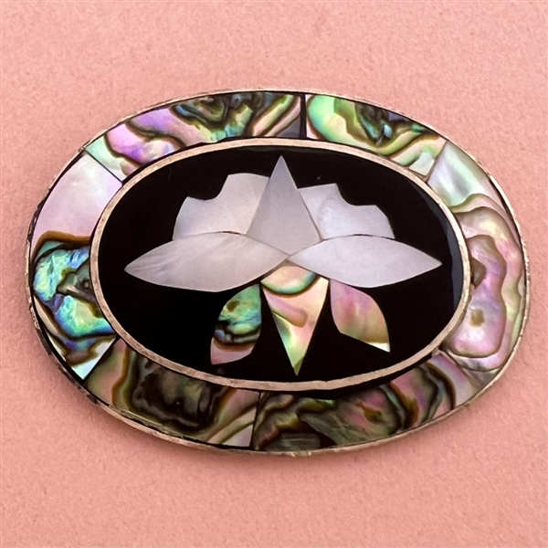 Pearl and abalone Mexican inlay button of a flower.