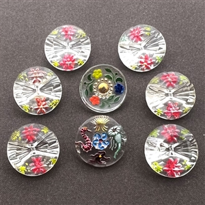 Eight Bohemian reverse painted glass buttons.