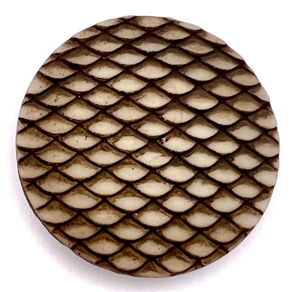 Glass button with sepia of imitation snake skin.